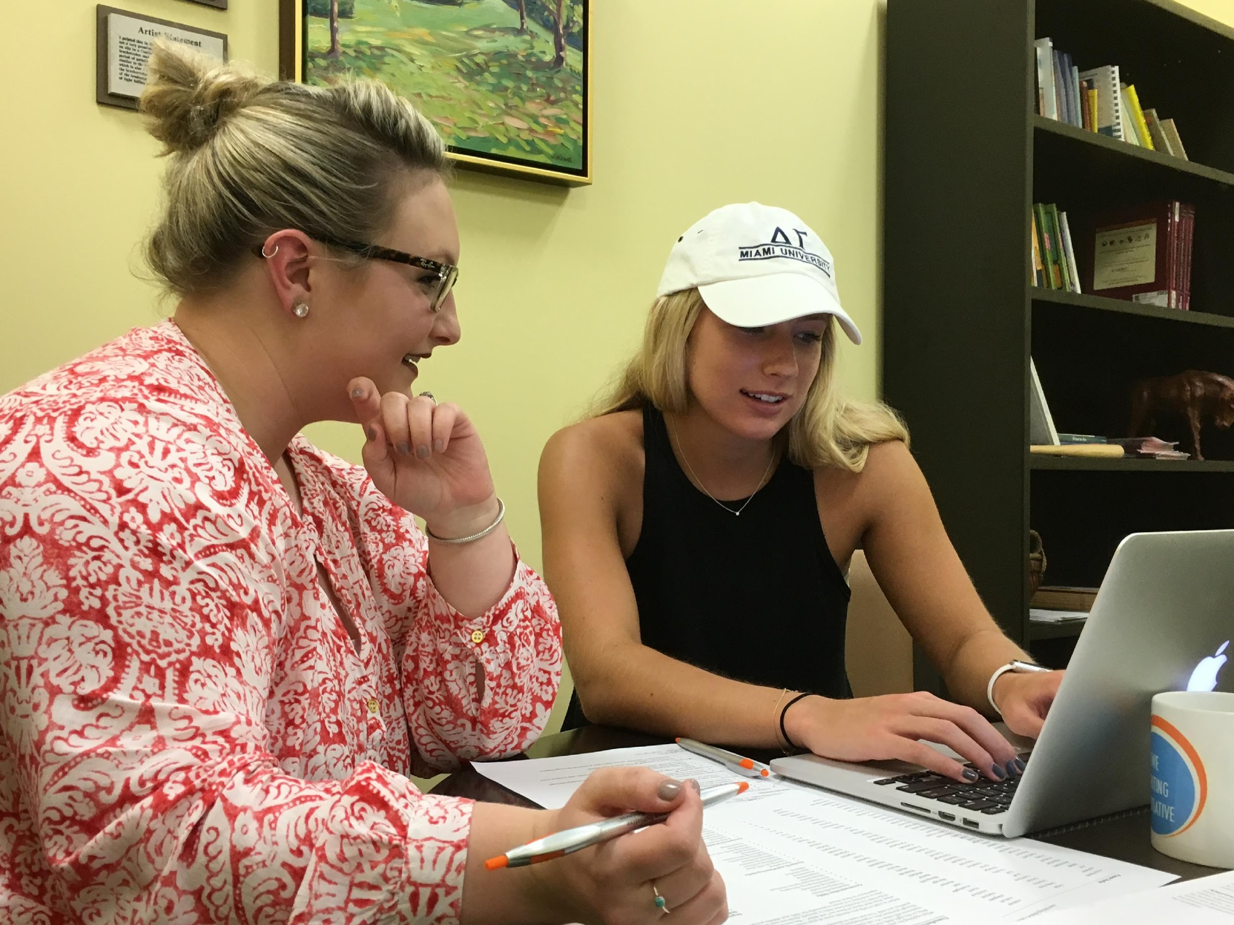 An HWI consultant and student work together within the writing center space. Photo by Heidi McKee.