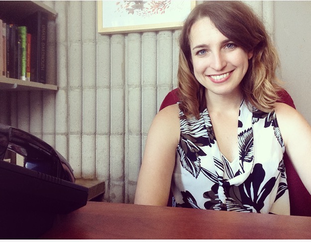 Author Elisabeth H. Buck sitting at her desk