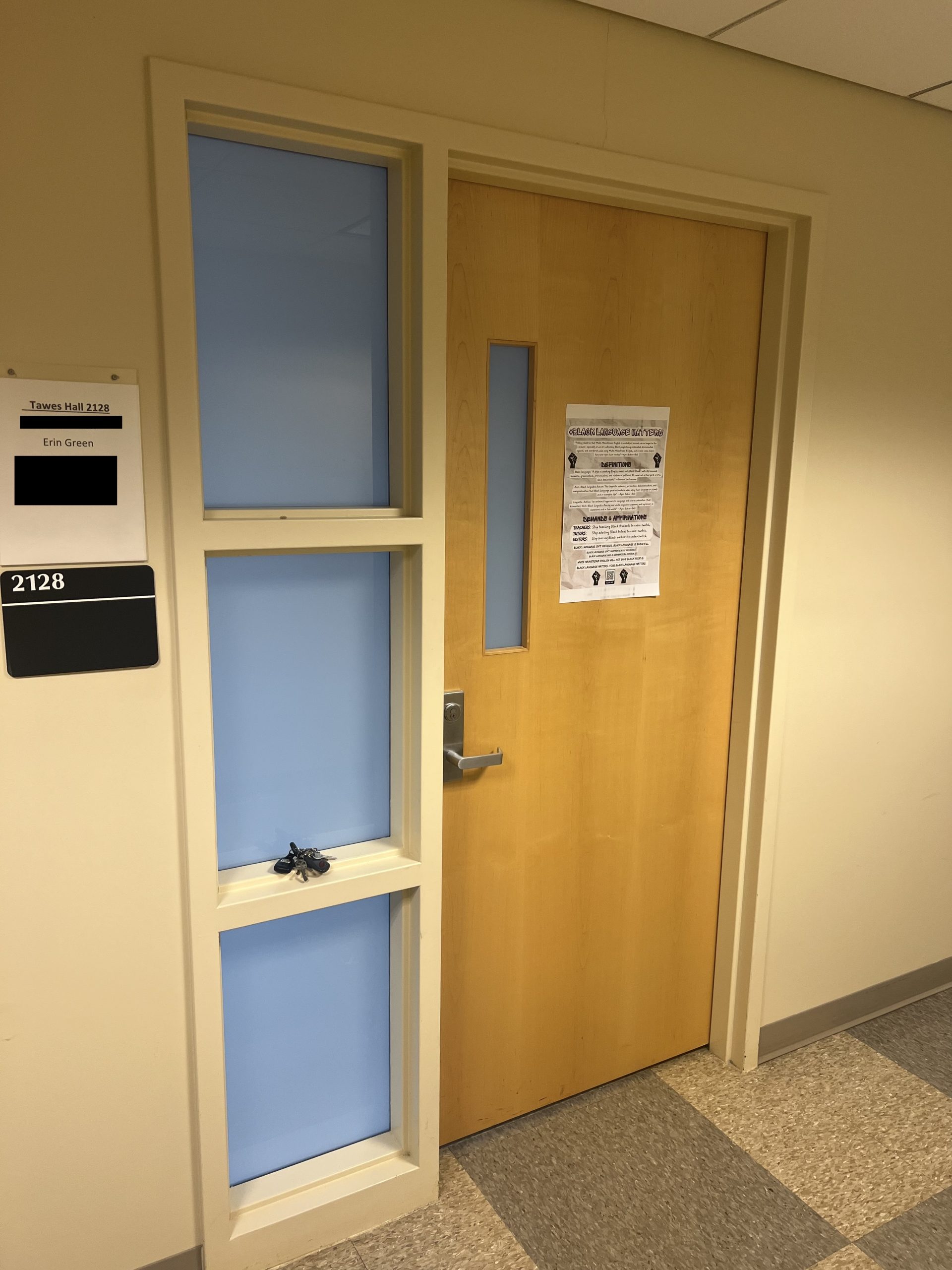 Figure 2. #BlackLanguageMatters poster taped to a brown office door in a hallway.