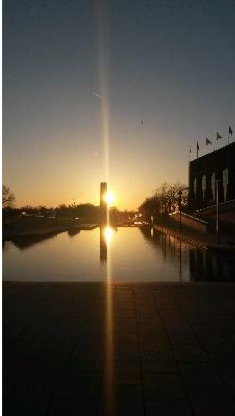 A sunset over a pond.